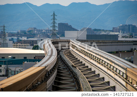 A view of the Osaka Monorail tracks curving over the city. A view of the Osaka Monorail tracks curving over the city. 141727121