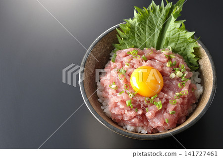 Negitoro Donburi and Tuna Tataki Donburi photographed against a black background. Negitoro Donburi and Tuna Tataki Donburi photographed against a black background. 141727461