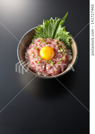 Negitoro Donburi and Tuna Tataki Donburi photographed against a black background. Negitoro Donburi and Tuna Tataki Donburi photographed against a black background. 141727468