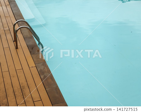 Poolside Ladder and Steps in Turquoise Water Poolside Ladder and Steps in Turquoise Water 141727515
