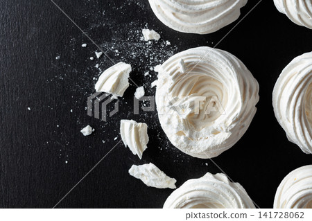 Broken meringue for making mini Pavlova desserts. Broken meringue for making mini Pavlova desserts. 141728062