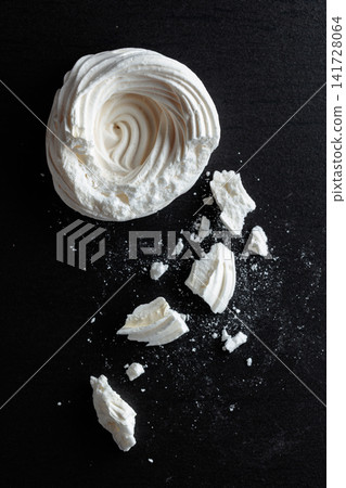 Broken meringue for making mini Pavlova desserts. Broken meringue for making mini Pavlova desserts. 141728064
