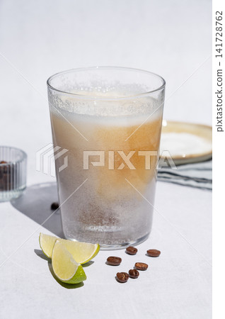 Coffee bomb with sparkling water and espresso shot, trendy summer coffee drink Coffee bomb with sparkling water and espresso shot, trendy summer coffee drink 141728762