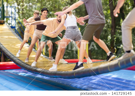 Group friends and family met over the weekend to go to the amusement park Group friends and family met over the weekend to go to the amusement park 141729145