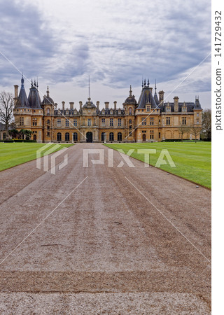 Grand Neo-Renaissance facade of Waddesdon Manor under a cloudy sky in Buckinghamshire Grand Neo-Renaissance facade of Waddesdon Manor under a cloudy sky in Buckinghamshire 141729432