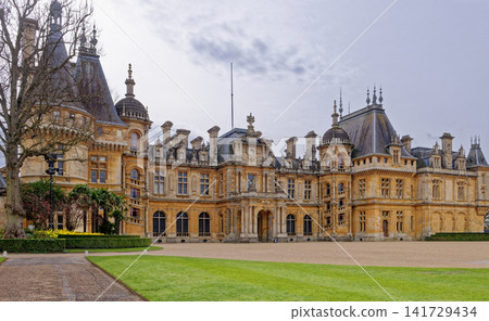 Grand Neo-Renaissance facade of Waddesdon Manor under a cloudy sky in Buckinghamshire Grand Neo-Renaissance facade of Waddesdon Manor under a cloudy sky in Buckinghamshire 141729434
