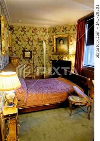 Historic Traditional Guest Bedroom Interior with Chintz Wallpaper at Waddesdon Manor Historic Traditional Guest Bedroom Interior with Chintz Wallpaper at Waddesdon Manor 141729501