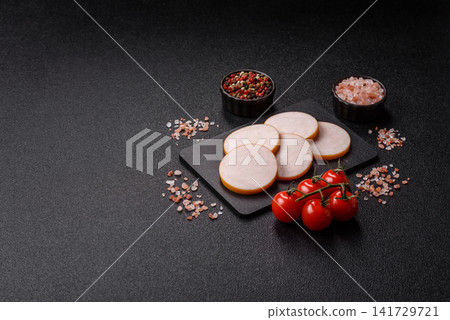 Slices of boiled chicken or pork sausage as an ingredient for home cooking. Sliced boiled sausage Slices of boiled chicken or pork sausage as an ingredient for home cooking. Sliced boiled sausage 141729721