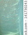Shimmery mint green glitter texture with soft bokeh and iridescent sparkle background 141730243