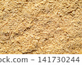 Close-up of nutritional yeast flakes texture, savory cheesy vegan seasoning and food ingredient background 141730244