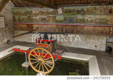 Vintage fire pump at lavoir in Cuisles, France Vintage fire pump at lavoir in Cuisles, France 141730355