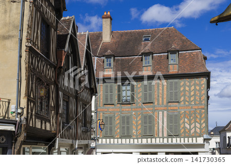 Traditional half timbered houses lining Auxerre street in France 141730365
