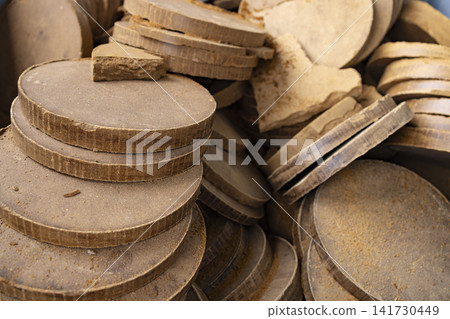 Round clay discs forming earthy background texture pattern Round clay discs forming earthy background texture pattern 141730449