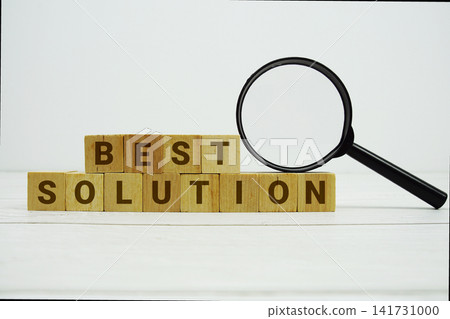 BEST SOLUTION alphabet letters with magnifying glass on wooden background 141731000