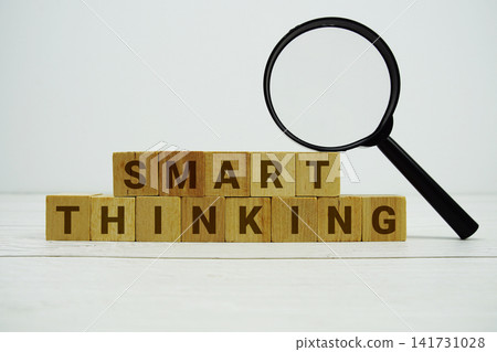 SMART THINKING alphabet letters with magnifying glass on wooden background SMART THINKING alphabet letters with magnifying glass on wooden background 141731028