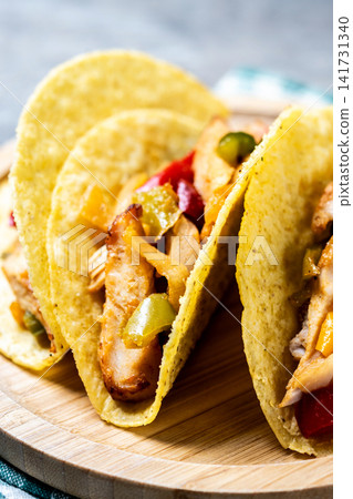 Mexican chicken tacos with bell peppers and onions Mexican chicken tacos with bell peppers and onions 141731340
