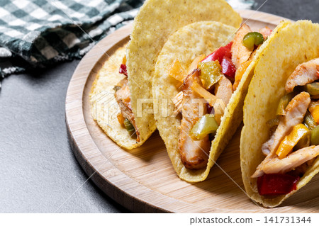 Chicken tacos with bell peppers and onions Chicken tacos with bell peppers and onions 141731344