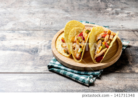 Mexican chicken tacos with bell peppers and onions Mexican chicken tacos with bell peppers and onions 141731348