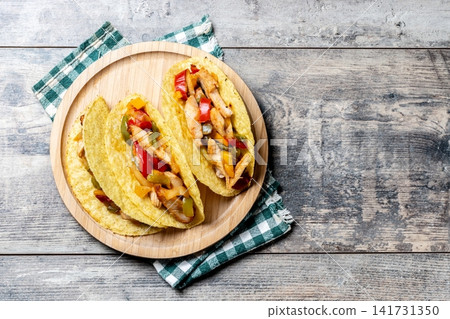 Mexican chicken tacos with bell peppers and onions Mexican chicken tacos with bell peppers and onions 141731350