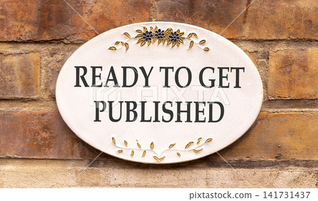 Ready to get published symbol. Concept words Ready to get published on beautiful white sign plate. Beautiful brick wall background. Business ready to get published motivational concept. Copy space 141731437