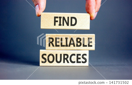 Find reliable sources words symbol. Concept words Find reliable sources on beautiful wooden blocks. Beautiful grey background. Businessman hand. Business find reliable sources concept. Copy space. Find reliable sources words symbol. Concept words Find reliable sources on beautiful wooden blocks. Beautiful grey background. Businessman hand. Business find reliable sources concept. Copy space. 141731502