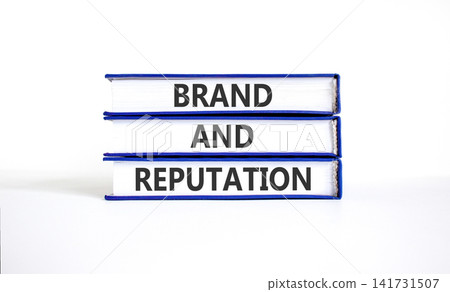 Brand and reputation words symbol. Concept words Brand and reputation on beautiful books. Beautiful white background. Business brand and reputation concept. Copy space. Brand and reputation words symbol. Concept words Brand and reputation on beautiful books. Beautiful white background. Business brand and reputation concept. Copy space. 141731507