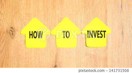 How to invest words symbol. Concept words How to invest on beautiful yellow paper houses. Beautiful wooden background. Business and how to invest concept. Copy space. How to invest words symbol. Concept words How to invest on beautiful yellow paper houses. Beautiful wooden background. Business and how to invest concept. Copy space. 141731508