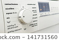 Washing Machine Control Dial with Laundry Programs and Digital Display Close Up 141731560