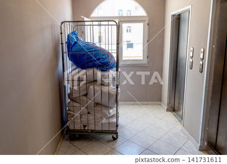 Hotel housekeeping cart with clean towels and bed linen Hotel housekeeping cart with clean towels and bed linen 141731611