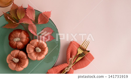Autumnal Table Setting with Velvet Pumpkins Decorative Leaves and Gold Cutlery Autumnal Table Setting with Velvet Pumpkins Decorative Leaves and Gold Cutlery 141731919