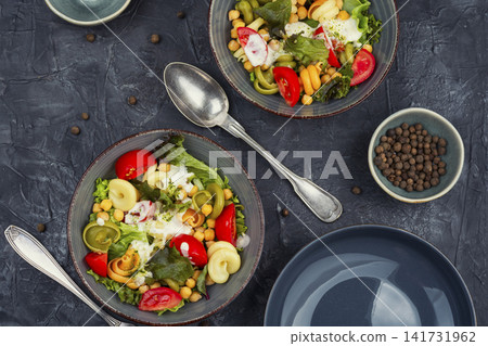 Mediterranean chickpea pasta salad with fresh vegetables Mediterranean chickpea pasta salad with fresh vegetables 141731962