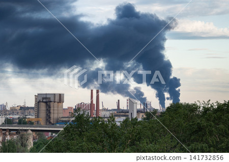 Plumes of multiple tall smokestacks rising in sky after fire accident at asphalt factory production Plumes of multiple tall smokestacks rising in sky after fire accident at asphalt factory production 141732856