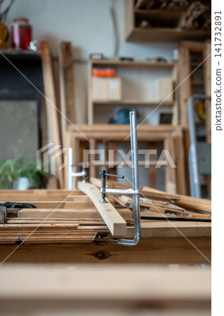 Restoration process in professional woodworking workshop, workbench with materials and tools. Restoration process in professional woodworking workshop, workbench with materials and tools. 141732891
