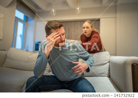 Deeply offended nervous husband in disappointment refusing contacting with worried woman partner Deeply offended nervous husband in disappointment refusing contacting with worried woman partner 141732922