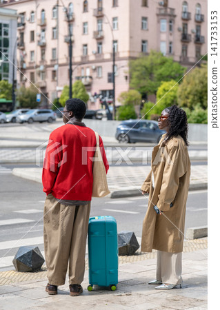 Thoughtful african american man and woman travelers exploring new country on holiday trip. Thoughtful african american man and woman travelers exploring new country on holiday trip. 141733153