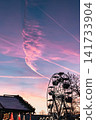 Ferris Wheel Silhouette Against Pink Sunset Sky 141733904