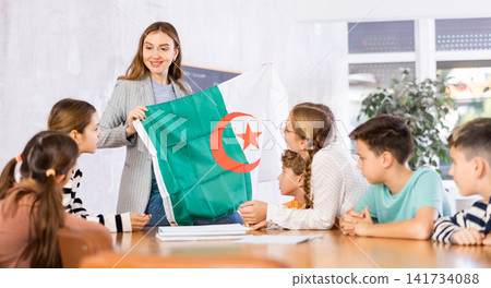 Teacher with flag of Algeria tells story of the emergence of state Teacher with flag of Algeria tells story of the emergence of state 141734088