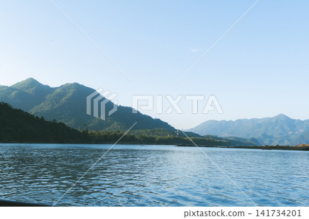 The Mekong River flows between Thailand and Laos. The Mekong River flows between Thailand and Laos. 141734201