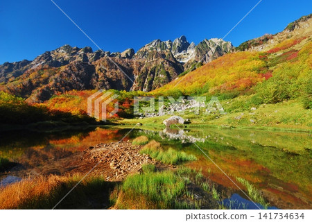 Mount Ura-Tsurugi shines brightly in the clear autumn sky. Mount Ura-Tsurugi shines brightly in the clear autumn sky. 141734634