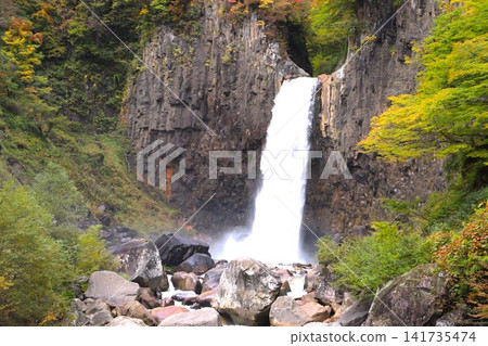 Autumn leaves begin to change color at Naena Falls, one of Japan's Top 100 Waterfalls, and the water falling into the waterfall basin. Autumn leaves begin to change color at Naena Falls, one of Japan's Top 100 Waterfalls, and the water falling into the waterfall basin. 141735474