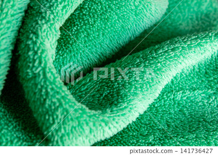 Green Microfiber Fabric Texture Abstract Background with Soft Folds Green Microfiber Fabric Texture Abstract Background with Soft Folds 141736427