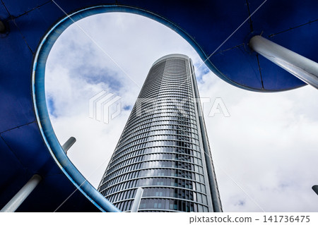 Modern tower framed by architectural canopy, Madrid, Spain 141736475