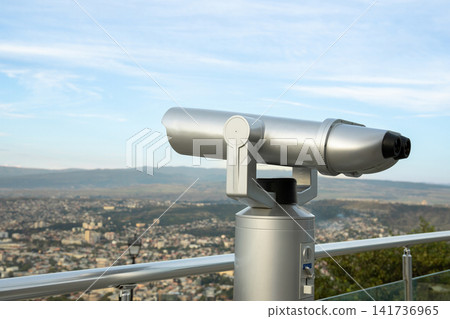 Telescope offers panoramic views of sprawling urban landscape below 141736965