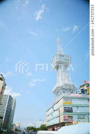 The cityscape and hot spring resort area spread out against the backdrop of the Beppu mountain range. The cityscape and hot spring resort area spread out against the backdrop of the Beppu mountain range. 141737355