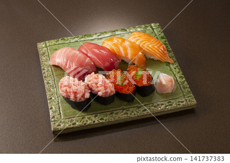 Assorted nigiri sushi: Bluefin tuna, salmon, salmon roe, and minced tuna with green onions. Assorted nigiri sushi: Bluefin tuna, salmon, salmon roe, and minced tuna with green onions. 141737383