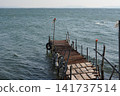 Pier protruding in the sea 141737514