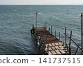 Pier protruding in the sea 141737515