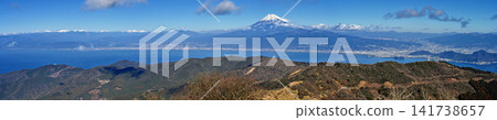 A panoramic view of snow-capped Mt. Fuji and the Southern Alps from the summit of Mt. Daruma on the Izu Ridge Trail of the Izu Peninsula. A panoramic view of snow-capped Mt. Fuji and the Southern Alps from the summit of Mt. Daruma on the Izu Ridge Trail of the Izu Peninsula. 141738657