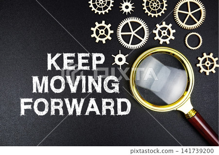 Keep Moving Forward text message with magnifying glass on black background 141739200