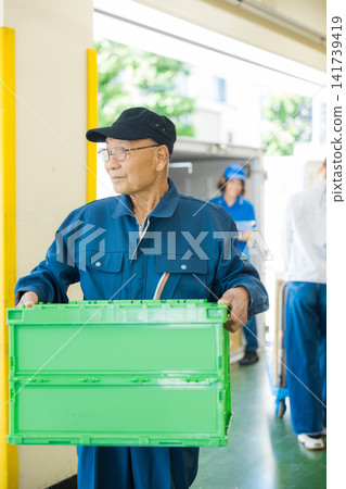 Worker standing in front of the truck Worker standing in front of the truck 141739419